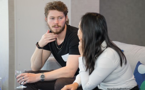 a man and woman sitting on a couch