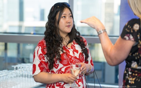 a woman holding a glass of wine