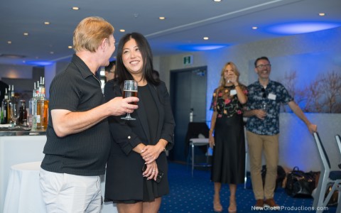 a man and woman holding a glass of wine
