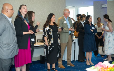 a group of people standing in a room