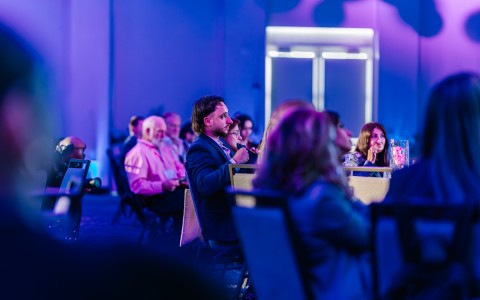 a group of people sitting in chairs