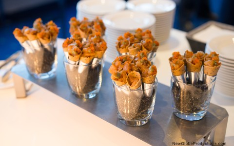 a group of small cups filled with food