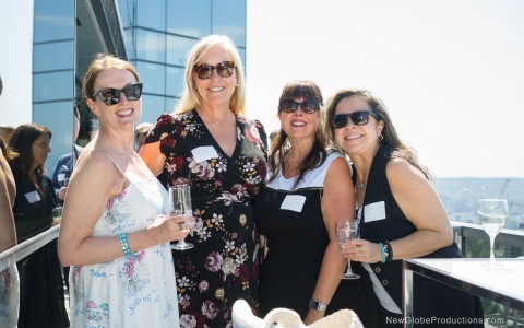 a group of women posing for a photo