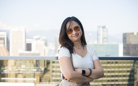 a woman standing with her arms crossed
