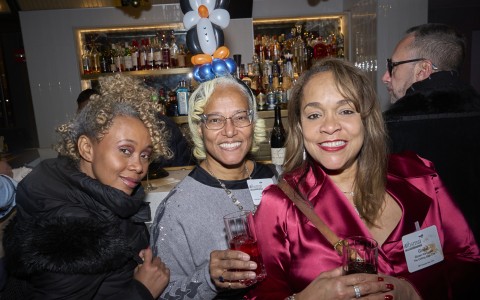 a group of women posing for a photo