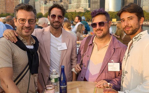 a group of men posing for a photo