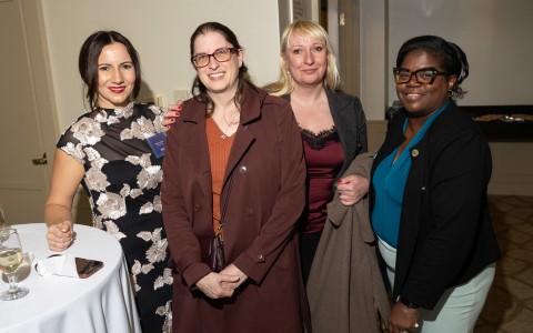 a group of women posing for a photo