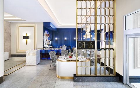 a room with a gold screen and blue walls