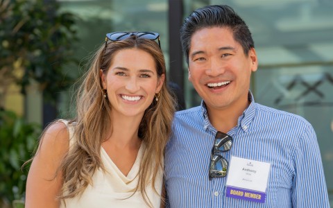 a man and woman smiling for a picture