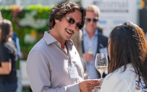 a man holding a glass of wine