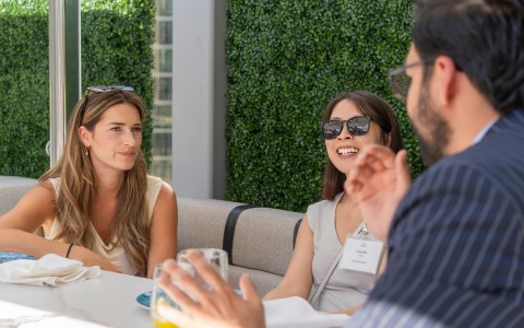 a group of people sitting at a table