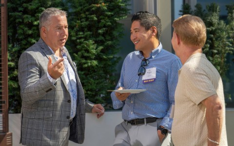 a group of men talking to each other