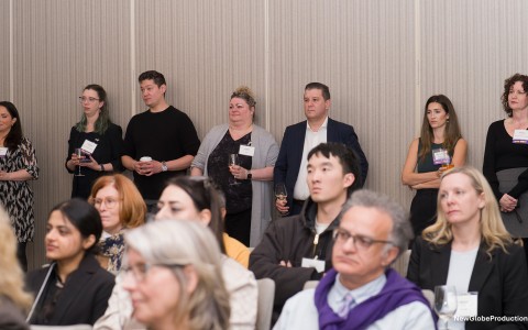 a group of people standing in a room