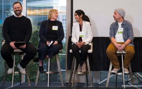 a group of people sitting on stools