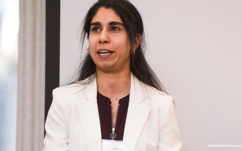 a woman in a white suit