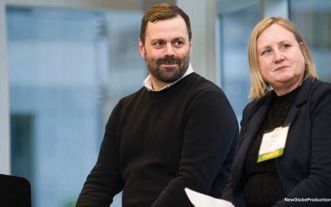 a man and woman sitting in a room