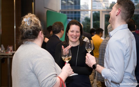 a group of people holding wine glasses