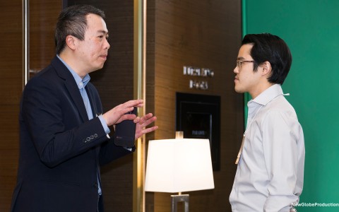 a man talking to another man