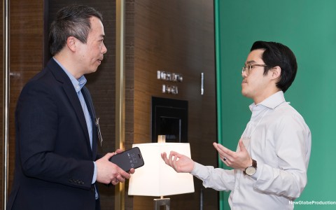 a man talking to another man