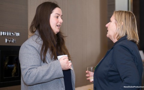 a woman talking to another woman