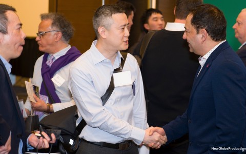 a man shaking hands with another man