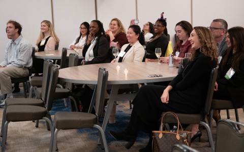 a group of women sitting at a table
