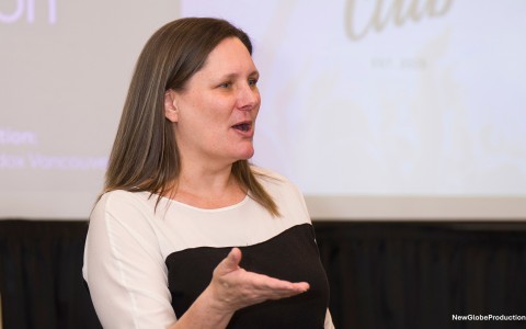 a woman speaking with her hand out