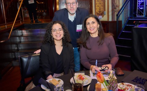 a group of people sitting at a table