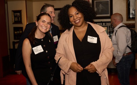 a group of people smiling at the camera