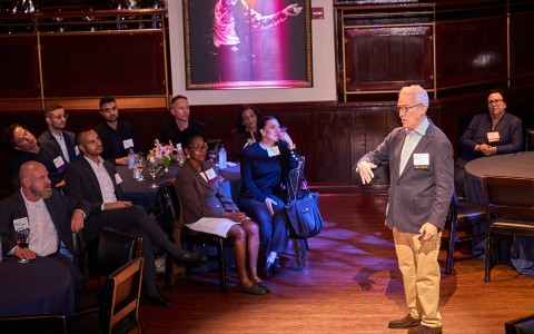 a man standing in front of a group of people