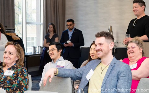 a group of people sitting at tables