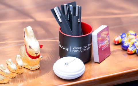 a pen holder and a container of pens