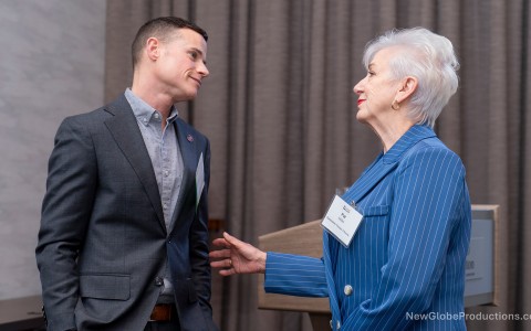 a man and woman talking to each other