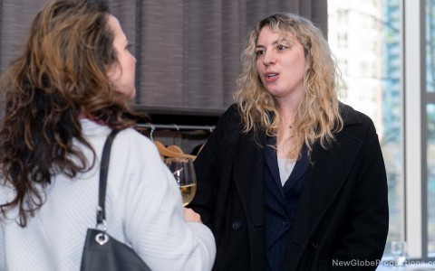a woman talking to another woman