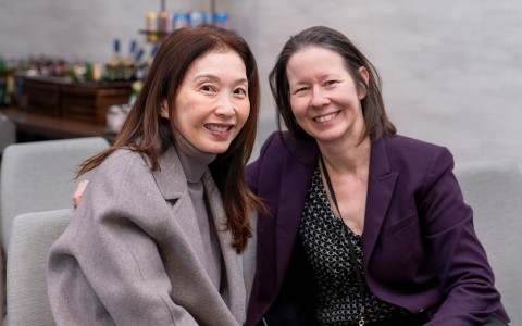 two women smiling at the camera