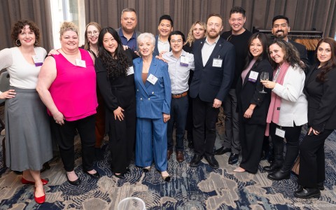 a group of people posing for a photo