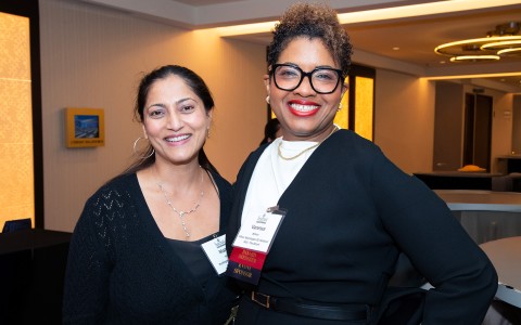 two women smiling at the camera