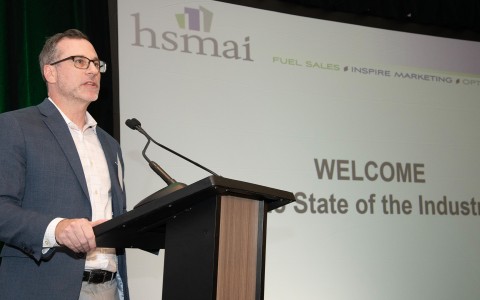 a man standing at a podium