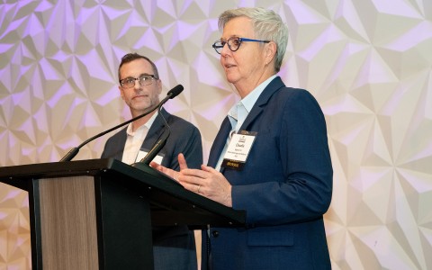 a man and woman standing at a podium