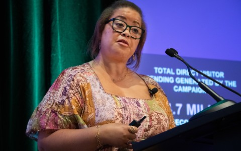 a woman standing at a podium
