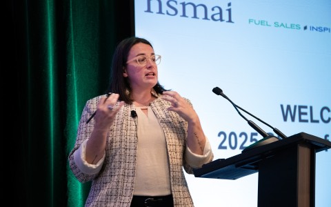 a woman standing at a podium