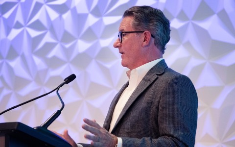 a man standing at a podium
