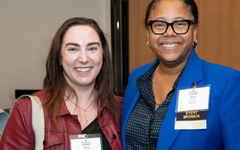 two women smiling at the camera