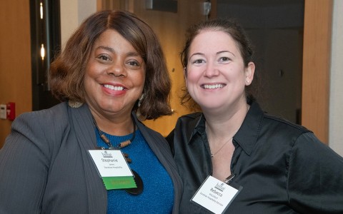 a group of women smiling at camera