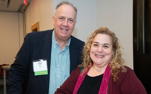 a man and woman smiling at camera