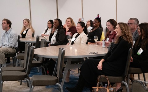 a group of women sitting at a table