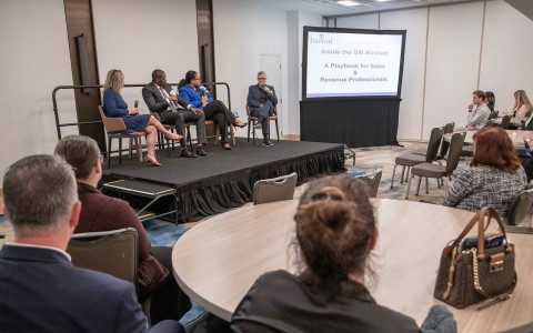 a group of people sitting on a stage