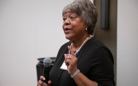 a woman holding a microphone