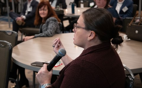 a woman holding a microphone