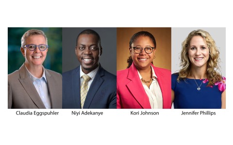 a group of people in suits